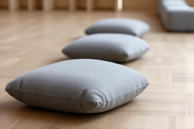 A row of meditation cushions in a quiet room.